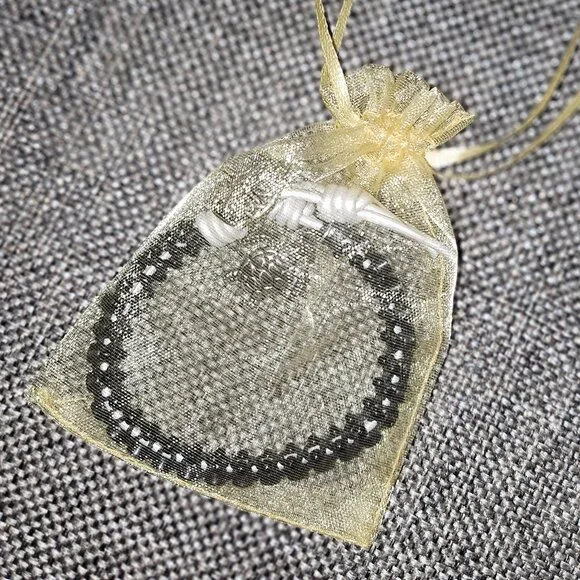 Bracelet with Rhinestones Set in Black Beads with White Tie and Turtle Charm - Picture 4 of 9